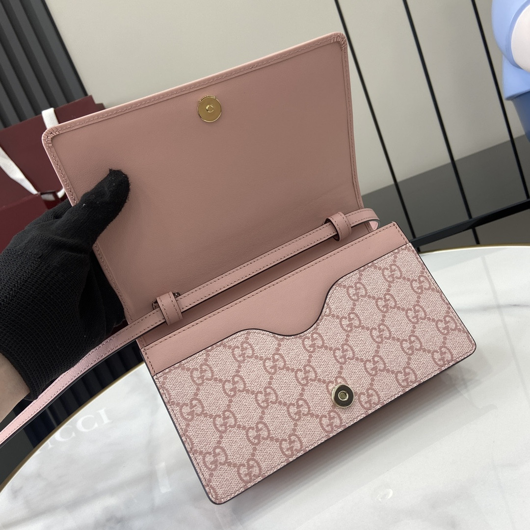 G*u*i emblem handbag